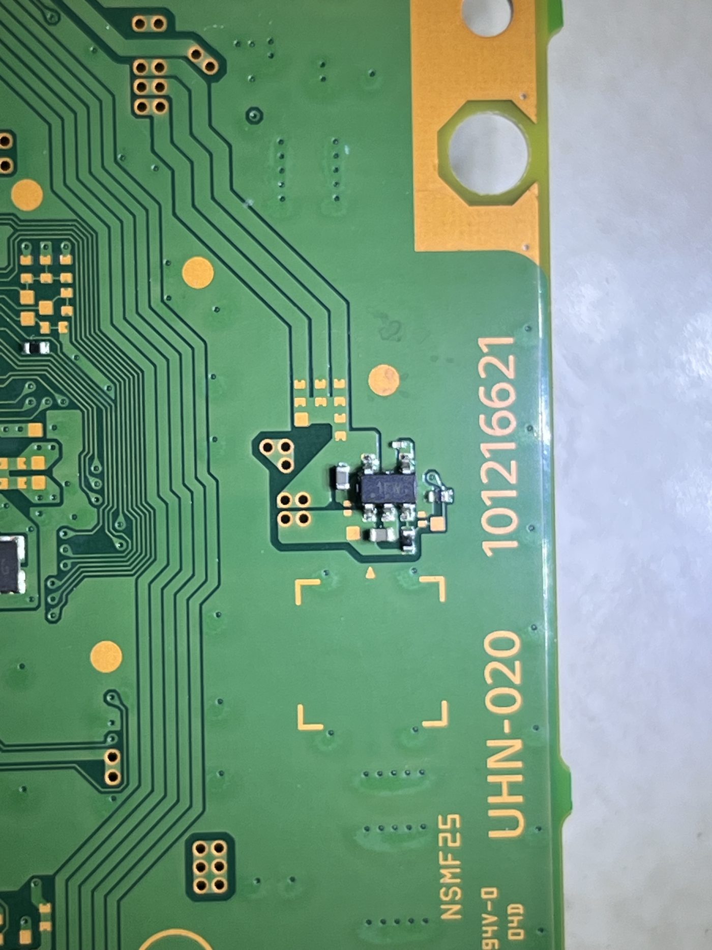 Close-up of the UHN-020 Blu-ray daughterboard area where the original short was found and nearby components were replaced