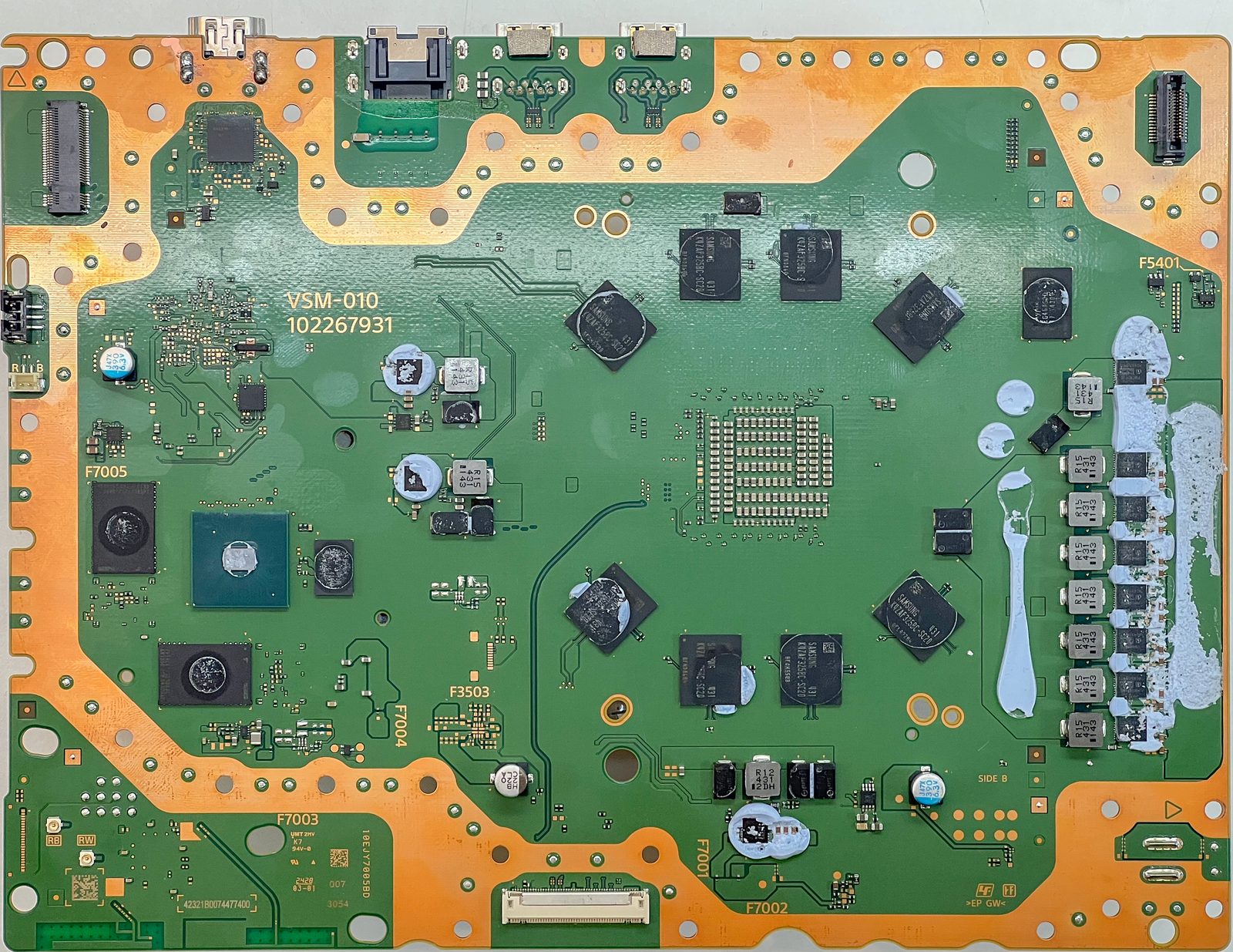 PS5 Pro motherboard underside showing surrounding power and signal circuitry