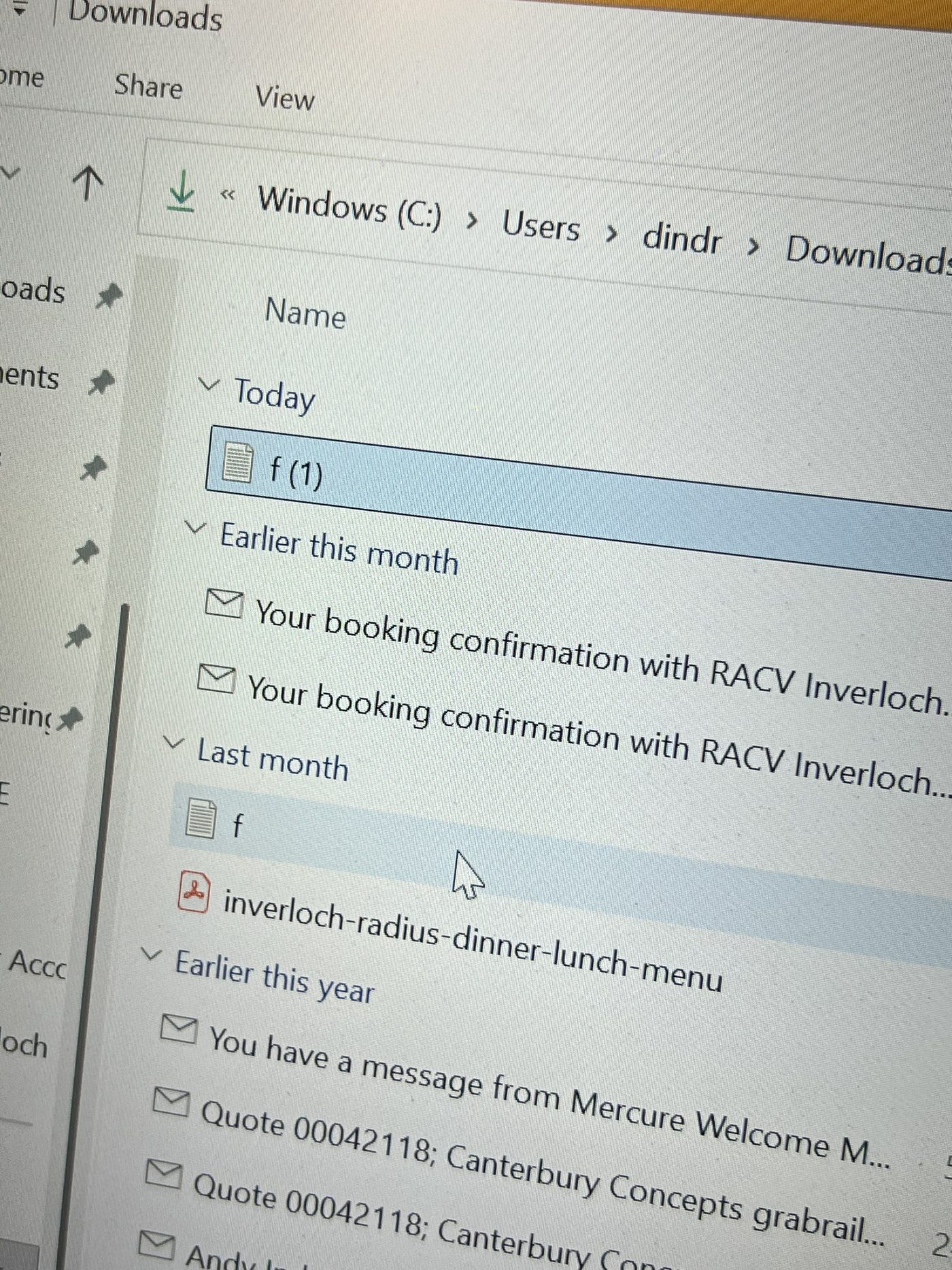 Suspicious file visible in the Windows Downloads folder