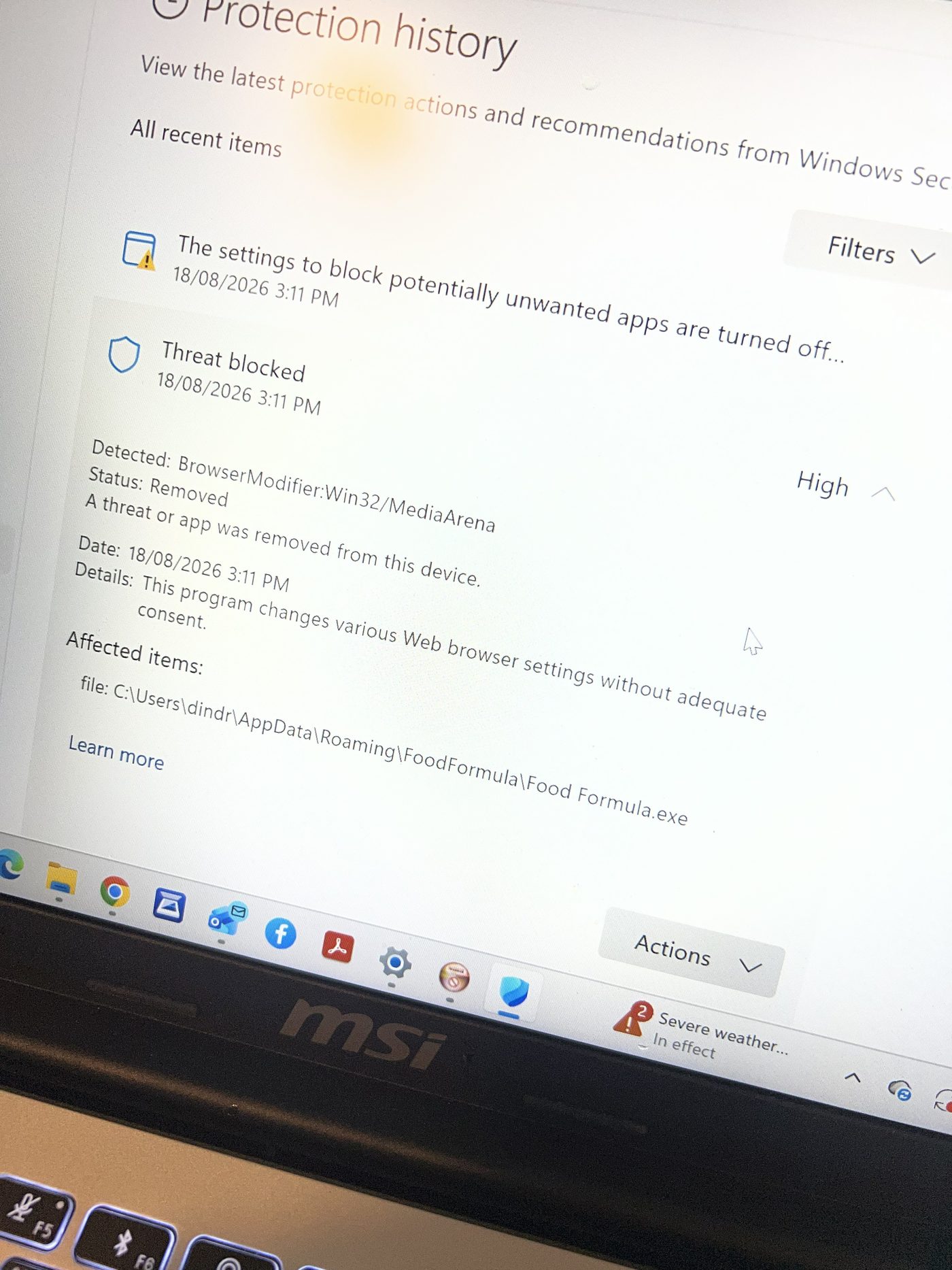 Windows Security protection history showing the browser modifier detection