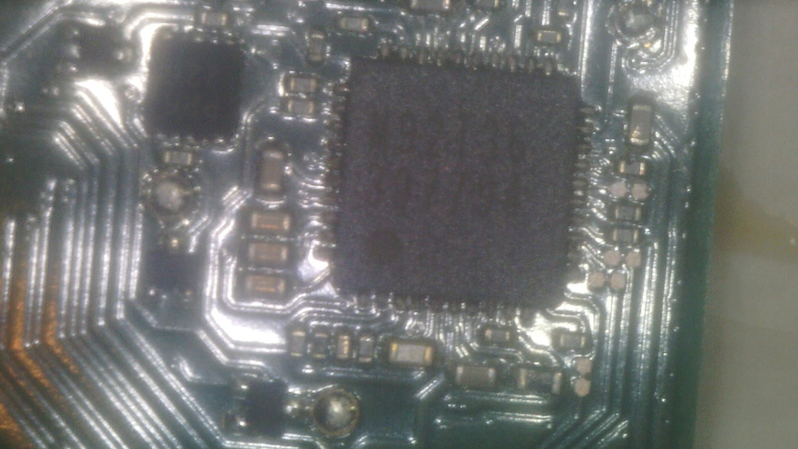 Close-up microscope view of the M92T36 IC on a Nintendo Switch OLED board